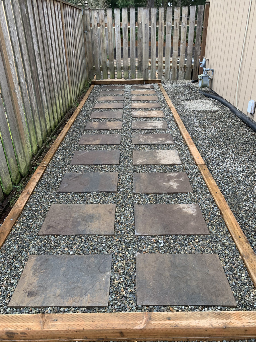 Framed gravel and stone slab pathway