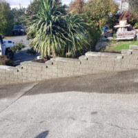This is a stepped wall, retaining a steeply graded yard. Having a properly built retaining wall can protect a beautiful landscape for years to come. Infinity Tree Services LLC was excited to work with the client on this wall. Stepped Retaining Wall On A Steep Grade