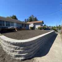 This yard needed some TLC! we're excited about the final results of this retaining wall; and so was our client! It's rewarding working on someones dreams and visions with them. Do you have a troubled landscape? Our retaining walls are one of the solutions we can apply to help you have your dream yard! After rebuilding a yard inside of a newly built retaining yard.